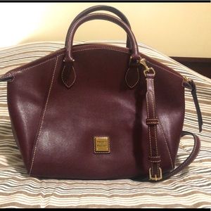 Dooney & Bourke burgundy leather purse with red lining, w/shoulder strap